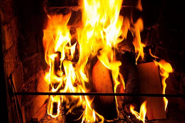 Wood fire burning in a masonry firebox