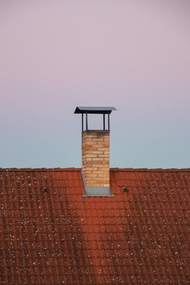 Roofline counter-flashing detail at a chimney base — Chimney Flashing Repair in Pompano Beach, FL