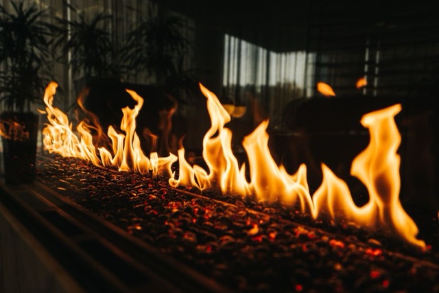 Gas log set alight inside a fireplace — Gas Fireplace Service in Pompano Beach, FL